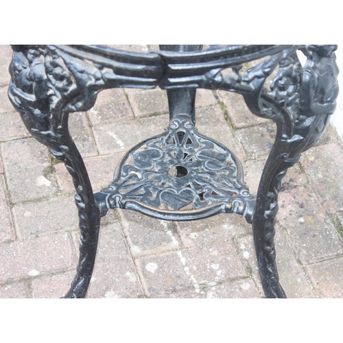 311 - An antique style cast iron pub or tavern table base, no top, approx 48cm in diameter x 69cm tall