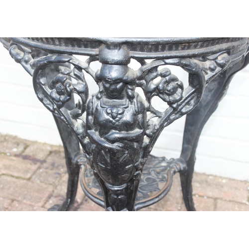 311 - An antique style cast iron pub or tavern table base, no top, approx 48cm in diameter x 69cm tall