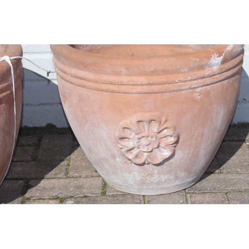 316 - A pair of vintage terracotta plant pots or planters, each approx 44cm in diameter x 37cm tall