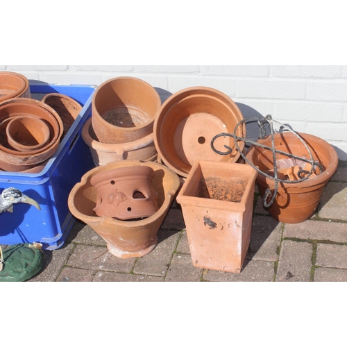 317 - A large qty of assorted plant pots, mainly terracotta etc, concrete Ibis etc