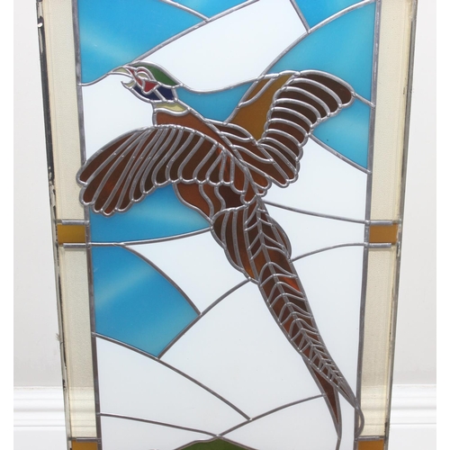 402 - A large vintage stained glass panel depicting a pheasant in flight, approx 120cm x 40cm