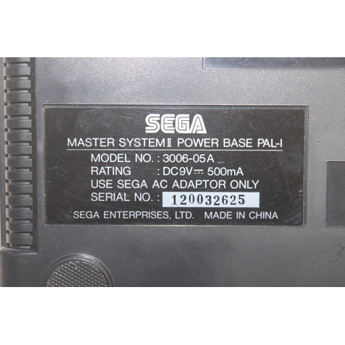 752 - A vintage Sega Master System II games console in original box to include games Thunder Blade and Cas... 