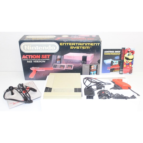 757 - A vintage Nintendo Entertainment System console in original box including Mario Bros Duck Hunt game,... 