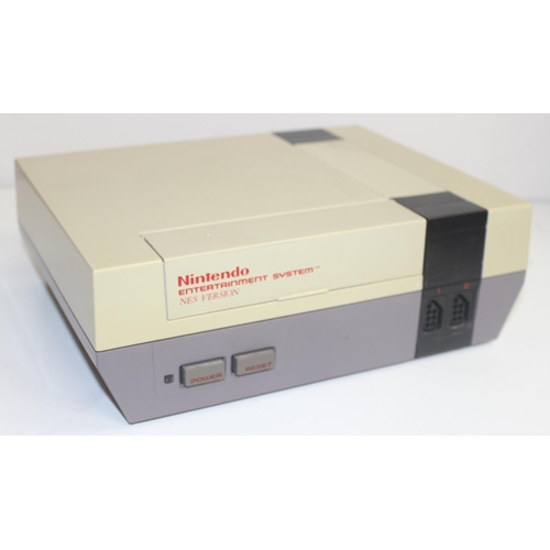 757 - A vintage Nintendo Entertainment System console in original box including Mario Bros Duck Hunt game,... 