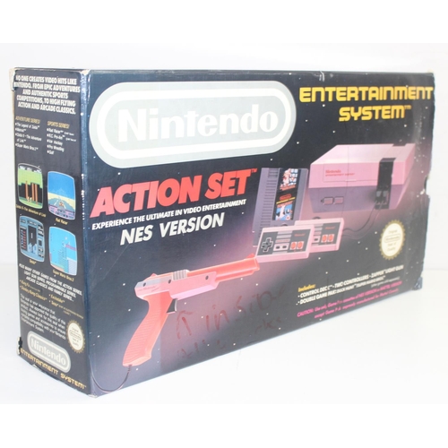 757 - A vintage Nintendo Entertainment System console in original box including Mario Bros Duck Hunt game,... 