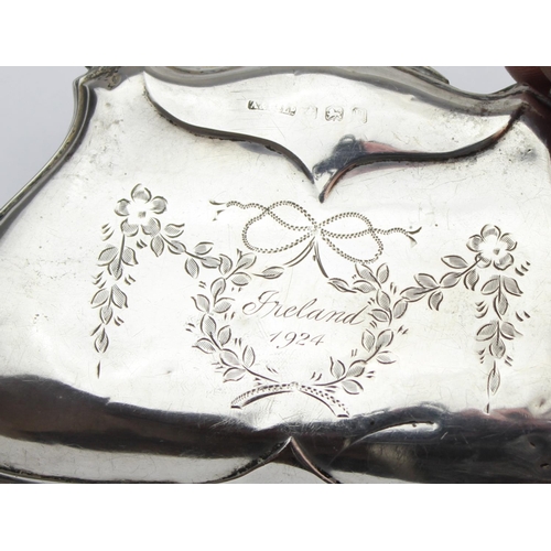 1013 - An antique silver evening bag or purse with engraved floral decoration and canvas line concertina in... 