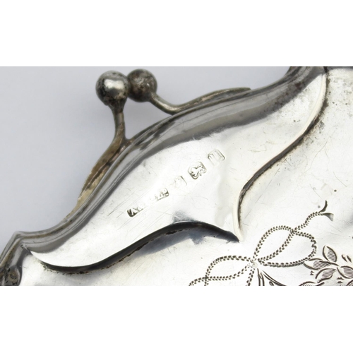 1013 - An antique silver evening bag or purse with engraved floral decoration and canvas line concertina in... 