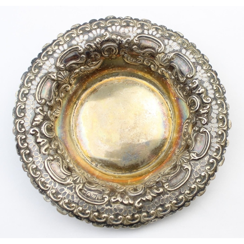 1014 - A Victorian embossed silver bonbon dish with gilt lined interior, Birmingham 1896 by Hayes Brothers,... 