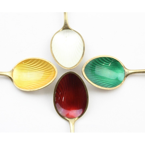 1023 - Danish Silver, a set of 4 harlequin silver gilt and enamel coffee or demitasse spoons, marked for Eg... 