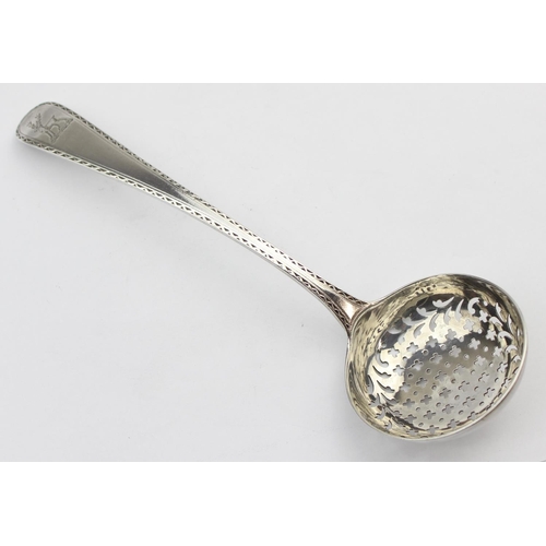 1036 - An 18th century silver sifter spoon with bright cut decoration, London 1756-1775 by Thomas Chawner, ... 