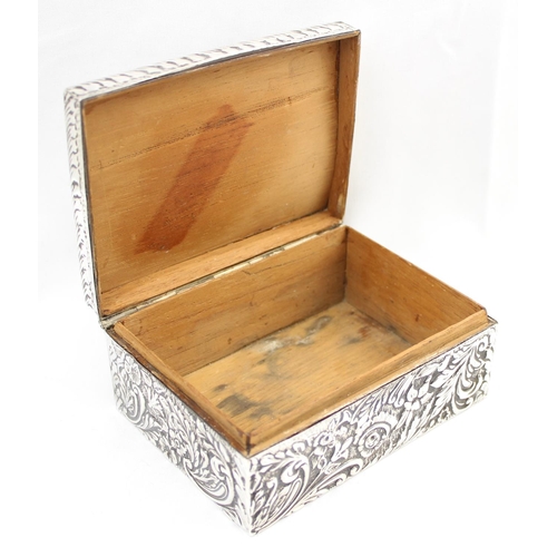 1050 - A highly decorative Chester silver cigar or cigarette box with embossed floral scrolls, marked for C... 