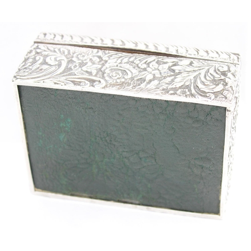 1050 - A highly decorative Chester silver cigar or cigarette box with embossed floral scrolls, marked for C... 