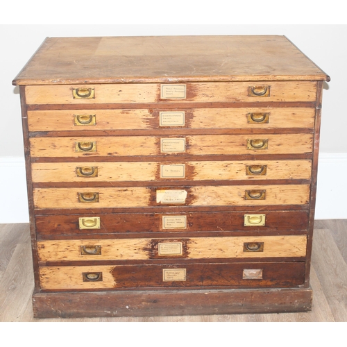 178 - A vintage stained pine plan chest, 8 drawers with campaign style recessed brass handles, approx 110c... 