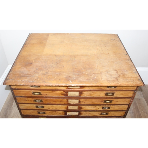 178 - A vintage stained pine plan chest, 8 drawers with campaign style recessed brass handles, approx 110c... 