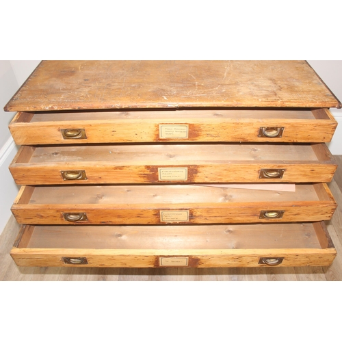 178 - A vintage stained pine plan chest, 8 drawers with campaign style recessed brass handles, approx 110c... 