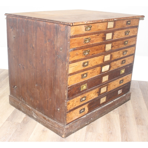 178 - A vintage stained pine plan chest, 8 drawers with campaign style recessed brass handles, approx 110c... 