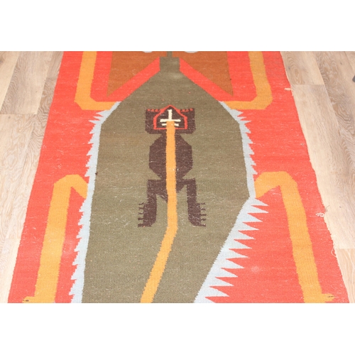 220 - A vintage flat weave rug with unusual colourful lizard decoration on orange ground, approx 300cm x 1... 