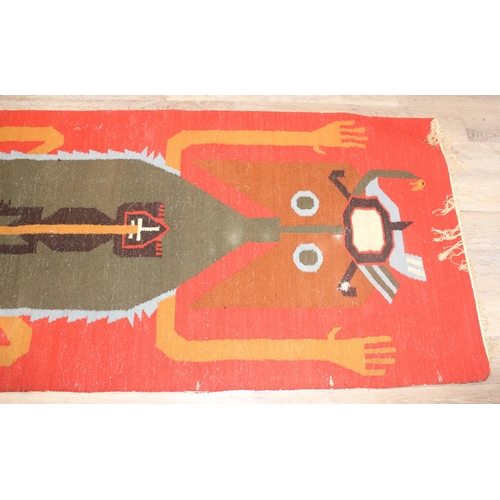 220 - A vintage flat weave rug with unusual colourful lizard decoration on orange ground, approx 300cm x 1... 