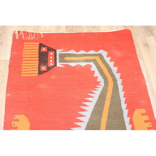 220 - A vintage flat weave rug with unusual colourful lizard decoration on orange ground, approx 300cm x 1... 