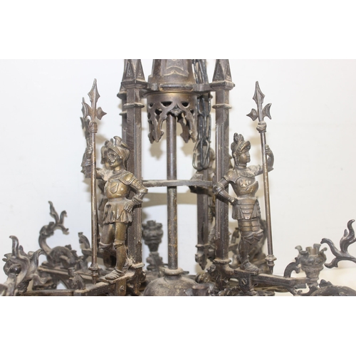 262 - A highly impressive Neo Gothic chandelier in patinated bronze, 8 alternating arms of up and down lig... 