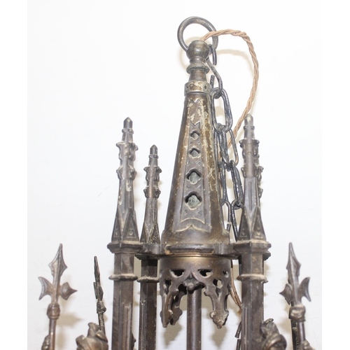 262 - A highly impressive Neo Gothic chandelier in patinated bronze, 8 alternating arms of up and down lig... 