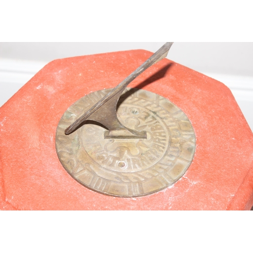 325 - The Stone Studio, garden sundial decorated as a young boy holding the top, approx 84cm H