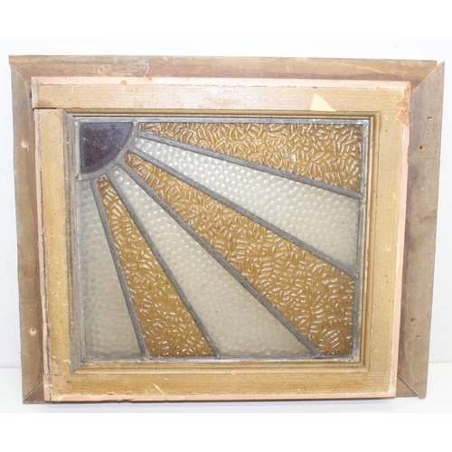 413 - An Art Deco period stained glass window of sunburst design in wooden frame, approx 54cm x 45cm inc f... 