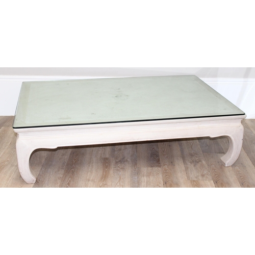 100 - An Oriental low tea table or coffee table, light or limed oak finish with woven top covered by glass... 