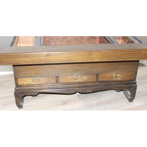 101 - A Japanese hardwood hibachi table with a central copper lined recess flanked by 2 smaller copper rec... 