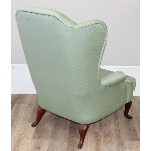 102 - 2 antique style wingback armchairs with wooden legs, one with celadon green coloured upholstery, the... 