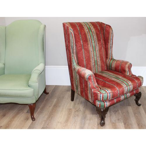 102 - 2 antique style wingback armchairs with wooden legs, one with celadon green coloured upholstery, the... 