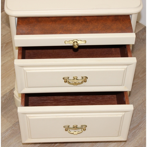 103 - A pair of white finished bedside cabinets by Olympus furniture, each with a slide and 2 drawers, eac... 