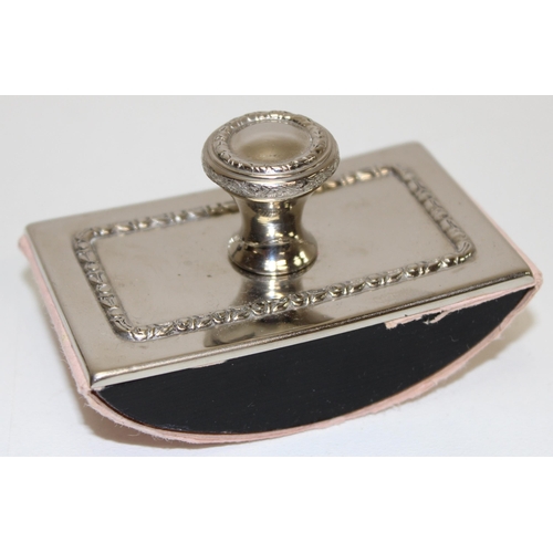 1039 - A vintage desk set comprising of a pair of glass inkwells and a desk blotter with silver plated moun... 