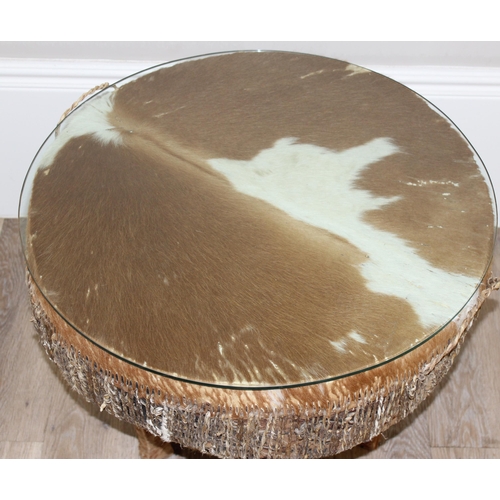 105 - A large vintage African cow hide drum with glass top, for use as a coffee or side table, approx 61cm... 