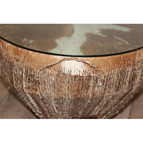 105 - A large vintage African cow hide drum with glass top, for use as a coffee or side table, approx 61cm... 