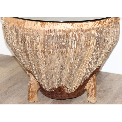 105 - A large vintage African cow hide drum with glass top, for use as a coffee or side table, approx 61cm... 