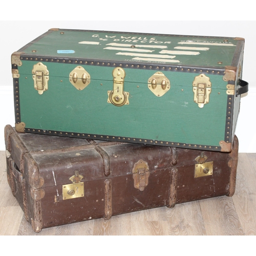 109 - 2 vintage shipping trunks, one with green covering the other with canvas and metal banding, the canv... 