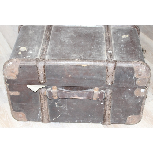 109 - 2 vintage shipping trunks, one with green covering the other with canvas and metal banding, the canv... 