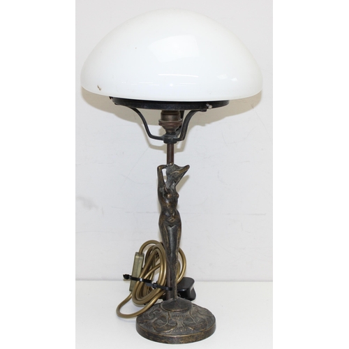 239 - An Art Nouveau style bronze table lamp formed as a nude female standing upon lily-pads with an opaqu... 