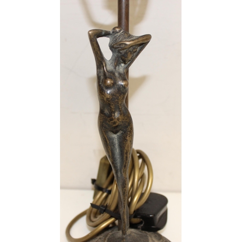 239 - An Art Nouveau style bronze table lamp formed as a nude female standing upon lily-pads with an opaqu... 