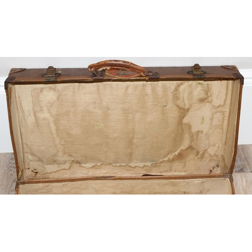 273 - 2 vintage suitcases with a large number of vintage luggage labels, the smaller case leather, the lar... 