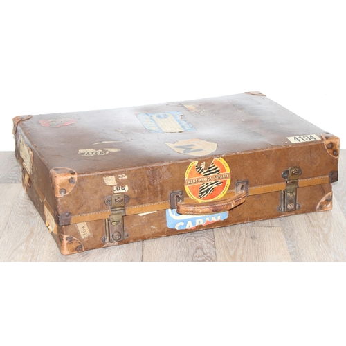 273 - 2 vintage suitcases with a large number of vintage luggage labels, the smaller case leather, the lar... 