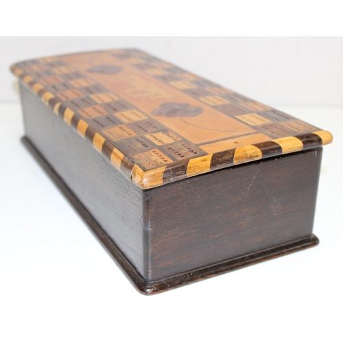 277 - An unusual early 20th century games box, the top formed as a double cribbage board with other marque... 