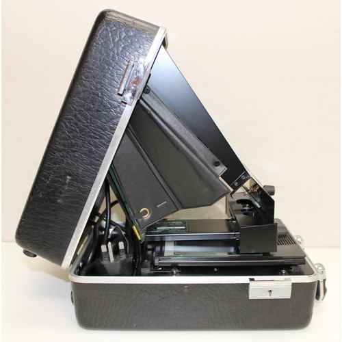 718 - A vintage portable Microphax Microfiche Case Series reader in case, with a number of Bosch car parts... 