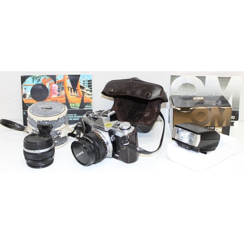 729 - Olympus OM-2n camera with 2 Olympus lenses 746414 and 144000 and a T20 electronic flash