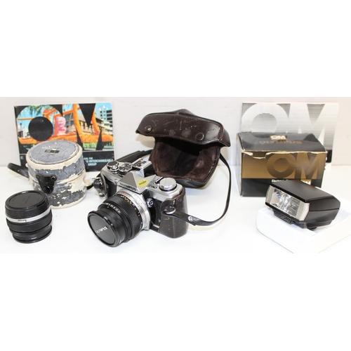 729 - Olympus OM-2n camera with 2 Olympus lenses 746414 and 144000 and a T20 electronic flash