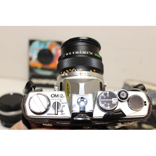 729 - Olympus OM-2n camera with 2 Olympus lenses 746414 and 144000 and a T20 electronic flash