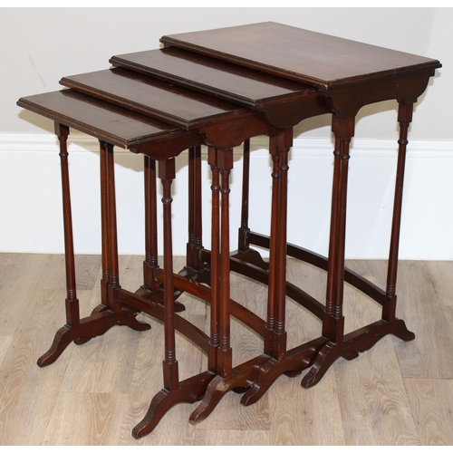 94 - An Edwardian style mahogany nest of 4 tables with turned legs, the largest approx 56cm wide x 35cm d... 