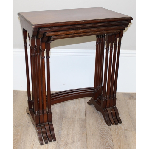 94 - An Edwardian style mahogany nest of 4 tables with turned legs, the largest approx 56cm wide x 35cm d... 