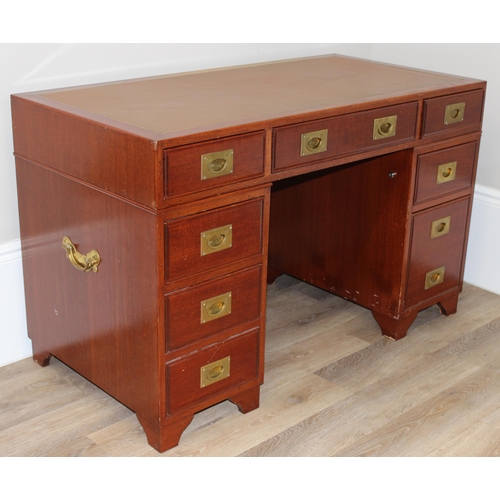 95 - A 20th century Oriental hardwood desk with brass campaign style handles and brown inset leather top,... 